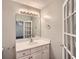 Bathroom vanity features modern faucet, recessed-panel cabinetry, and updated lighting at 91 Davis Mill Ct, Lawrenceville, GA 30044