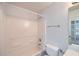 Bathroom featuring bath tub and shower, neutral color palette and lots of light at 91 Davis Mill Ct, Lawrenceville, GA 30044