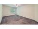 Spacious bedroom with neutral carpet, ceiling fan, and large window at 91 Davis Mill Ct, Lawrenceville, GA 30044