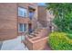 Brick townhouse with cozy entrance and well-manicured landscaping, creating a welcoming atmosphere at 91 Davis Mill Ct, Lawrenceville, GA 30044