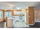 Open kitchen with white appliances, cabinets, and a light-filled eat-in breakfast area at 91 Davis Mill Ct, Lawrenceville, GA 30044