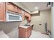 Kitchenette featuring wood cabinets, a stainless steel sink and a built in microwave at 91 Davis Mill Ct, Lawrenceville, GA 30044