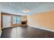 Bright living room with hardwood floors, brick fireplace and neutral walls for a comfortable living space at 91 Davis Mill Ct, Lawrenceville, GA 30044