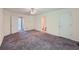 Large main bedroom features neutral carpeting, ceiling fan, and ensuite access at 91 Davis Mill Ct, Lawrenceville, GA 30044