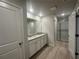 Modern bathroom with granite countertops, dual sinks, and a glass-enclosed shower at 11045 Shadow Creek Ter, Hampton, GA 30228
