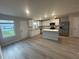 Bright kitchen featuring white cabinets, stainless steel appliances, granite countertops, and a convenient center island at 11045 Shadow Creek Ter, Hampton, GA 30228