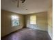 Bedroom featuring natural light and original wood flooring; a blank canvas for customization and decor at 1417 Richland Rd, Atlanta, GA 30310