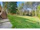 Spacious backyard features a lush lawn and a wooden staircase at 1468 North Amanda Cir, Atlanta, GA 30329