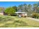 Charming brick home featuring a well-maintained lawn and mature trees, offering great curb appeal at 1468 North Amanda Cir, Atlanta, GA 30329