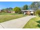 Inviting brick home with a long driveway and beautiful landscaping, blending comfort and style at 1468 North Amanda Cir, Atlanta, GA 30329