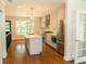 Modern kitchen with white cabinets, stainless steel appliances, and an island, ideal for cooking and gathering at 1468 North Amanda Cir, Atlanta, GA 30329