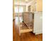 Custom kitchen island with pull-out metal storage solution and hardwood flooring at 1468 North Amanda Cir, Atlanta, GA 30329