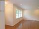 Bright living room featuring hardwood floors, recessed lighting, and three large windows at 1468 North Amanda Cir, Atlanta, GA 30329