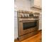 Stainless steel oven with white cabinets and a white subway tile backsplash at 1468 North Amanda Cir, Atlanta, GA 30329