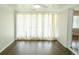 Bright sunroom features hardwood floors, fan, and lots of natural light at 1468 North Amanda Cir, Atlanta, GA 30329