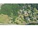 Aerial view of the property boundaries featuring a home, mature trees, and large grassy field in a rural setting at 2100 Highway 138 E E, Stockbridge, GA 30281