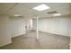 A large, carpeted basement features white walls, a support column, and multiple white closet doors at 2100 Highway 138 E E, Stockbridge, GA 30281