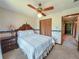 Cozy bedroom with a ceiling fan, wardrobe closet, and a comfortable bed and nightstand at 2100 Highway 138 E E, Stockbridge, GA 30281