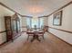 Formal dining room with elegant chandelier, and bay windows at 2100 Highway 138 E E, Stockbridge, GA 30281