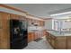 Bright kitchen featuring wood cabinetry, a gas cooktop, stainless steel appliances, and a tile floor at 2100 Highway 138 E E, Stockbridge, GA 30281