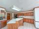 Traditional kitchen with oak cabinetry, kitchen island, and white countertops at 2100 Highway 138 E E, Stockbridge, GA 30281