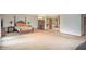 Spacious main bedroom with dark furniture, neutral carpet, and large windows at 2100 Highway 138 E E, Stockbridge, GA 30281