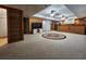 Finished basement boasting a large entertainment area with a bar and refrigerator at 1225 Creek Laurel Dr, Lawrenceville, GA 30043