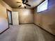 Bedroom with carpet, ceiling fan, neutral walls, and door leading to other room at 1225 Creek Laurel Dr, Lawrenceville, GA 30043