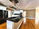 Well-equipped kitchen with stainless steel appliances, granite counters, and a modern range hood at 1225 Creek Laurel Dr, Lawrenceville, GA 30043