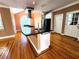 Modern kitchen with black appliances, granite counters, and a view of the backyard at 1225 Creek Laurel Dr, Lawrenceville, GA 30043