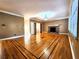 Spacious living room featuring a brick fireplace, hardwood floors, and a neutral color scheme at 1225 Creek Laurel Dr, Lawrenceville, GA 30043