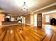 Open living space with hardwood floors connecting the kitchen and dining areas at 1225 Creek Laurel Dr, Lawrenceville, GA 30043