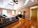 Large main bedroom featuring hardwood floors, a ceiling fan, and ample natural light at 1225 Creek Laurel Dr, Lawrenceville, GA 30043