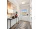 Bright entryway with a console table, modern art, and a door with glass inserts at 24 Jacobs Farm Ln # 12, Lawrenceville, GA 30045