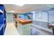 Spacious finished basement showcasing a full bar with wine storage and sleek flooring at 3627 Groovers Lake Rd, Lithia Springs, GA 30122