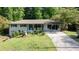 Charming ranch-style house featuring a brick facade, inviting front porch, and a well-maintained front yard at 3627 Groovers Lake Rd, Lithia Springs, GA 30122