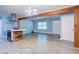Open-concept living space featuring hardwood floors, an island cooktop, and lots of light at 3627 Groovers Lake Rd, Lithia Springs, GA 30122