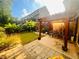 A backyard with a small lawn and a patio with outdoor seating at 4260 Hammond Bridge Dr, Suwanee, GA 30024
