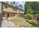Backyard view featuring a pergola, small lawn, and mature trees providing privacy at 4260 Hammond Bridge Dr, Suwanee, GA 30024
