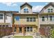 Backyard view of the townhome with a wooden fence, pergola, and small lawn area at 4260 Hammond Bridge Dr, Suwanee, GA 30024