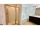 Bathroom featuring a separate shower, tub, and a dark wood vanity at 4260 Hammond Bridge Dr, Suwanee, GA 30024