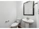 Cozy half-bathroom featuring a sleek sink and toilet at 4260 Hammond Bridge Dr, Suwanee, GA 30024