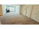 Spacious bedroom with neutral carpet, two closets, and a window for natural light at 4260 Hammond Bridge Dr, Suwanee, GA 30024