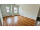 Bedroom with hardwood floors and windows offering natural light at 4260 Hammond Bridge Dr, Suwanee, GA 30024