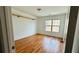 Cozy bedroom with hardwood floors, a ceiling with star accents and a large window at 4260 Hammond Bridge Dr, Suwanee, GA 30024