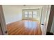 Bright bedroom featuring hardwood floors and large windows for natural light at 4260 Hammond Bridge Dr, Suwanee, GA 30024