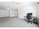 Bonus room with neutral carpet, doors to other rooms and a small desk setup at 4260 Hammond Bridge Dr, Suwanee, GA 30024