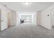 Spacious bonus room with neutral carpet, office setup, and multiple doors for easy access at 4260 Hammond Bridge Dr, Suwanee, GA 30024