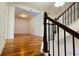 Foyer with hardwood floors, view of the staircase and an open living space at 4260 Hammond Bridge Dr, Suwanee, GA 30024