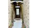 Front entrance featuring a brick facade, covered porch, and decorative accents at 4260 Hammond Bridge Dr, Suwanee, GA 30024